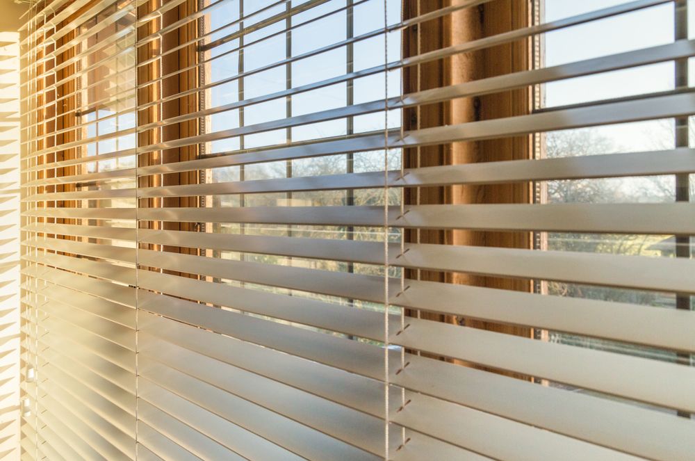 Blinds in a home catching the sunlight