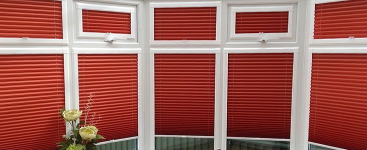 perfect fit blinds in red on conservatory windows