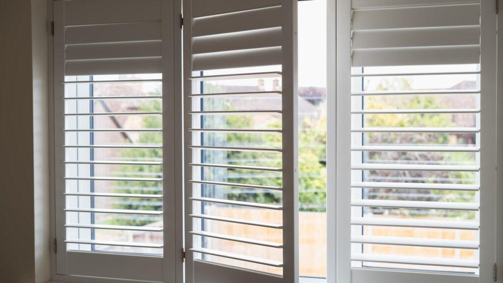 white wooden shutters